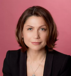 Head shot of speaker looking seriously at the camera