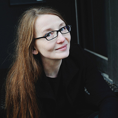 Portrait of Emma Braslavsky with a soft smile