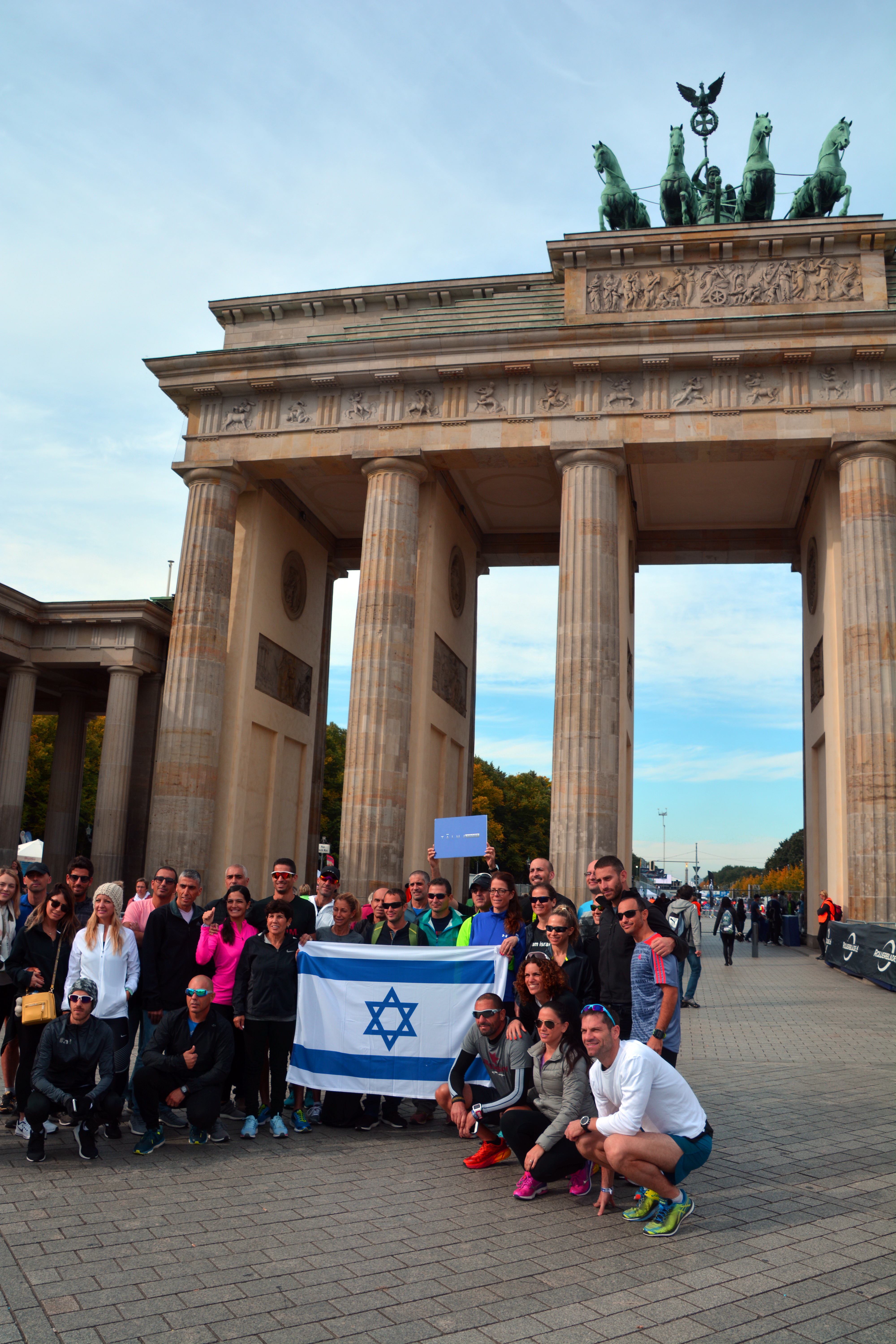 A team of Jewish runners from Israel for the Berlin marathon take a picture in front of the Brandenburg Gate