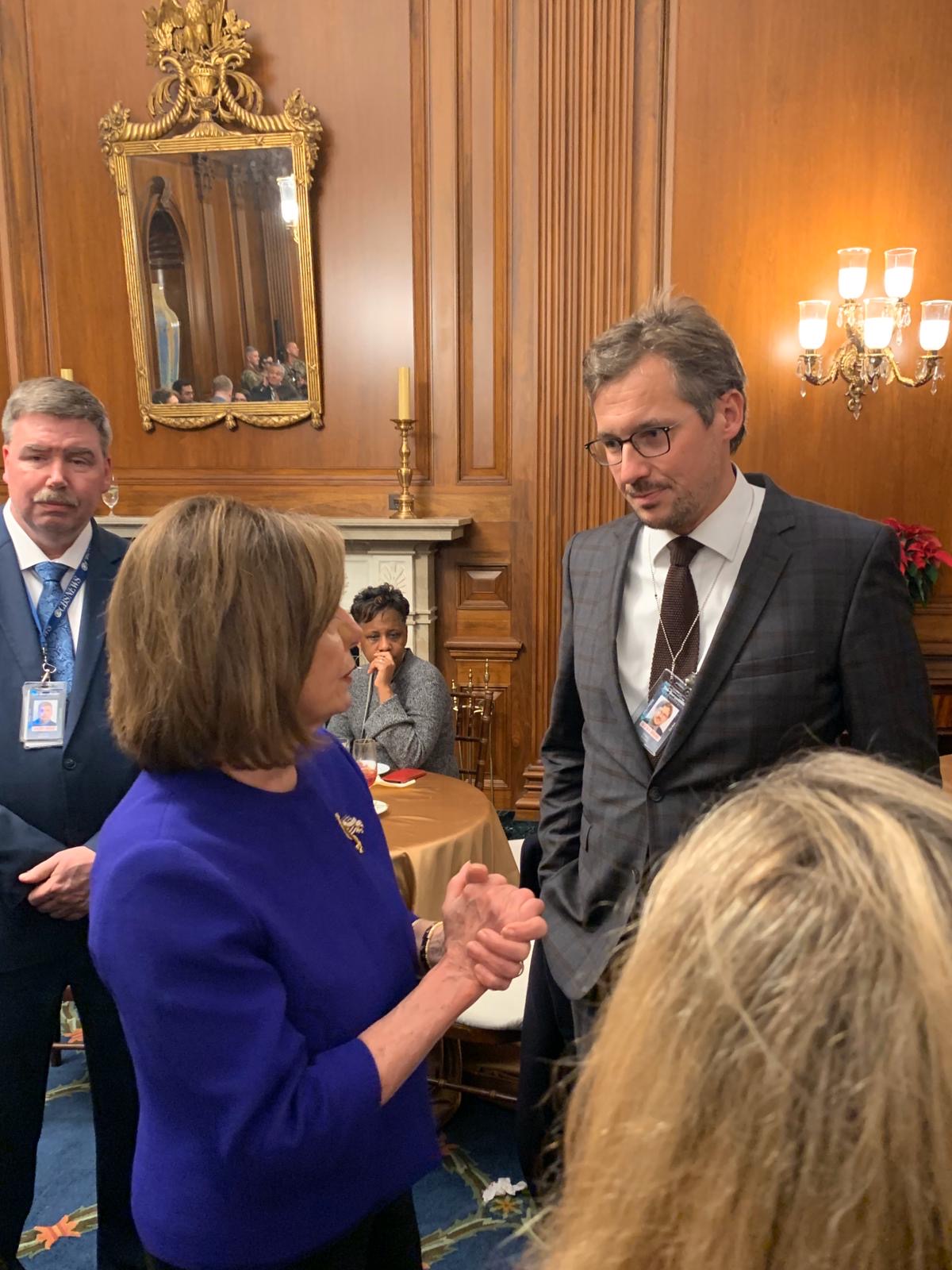 Daniel Sturm talking to Nancy Pelosi