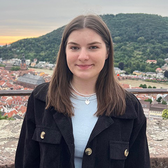 Headshot of Carina Domat with a soft smile