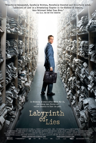 Film poster for "Labyrinth of Lies." Photo is of a man in a suit, holding a briefcase, standing in an aisle of ceiling-high shelving filled with file folders. His head turns to look back at the viewer.  Text reads: "Documented, carefully written, forcefully directed and skillfully acted. Labyrinth of Lies' is a devastating chapter in the history of justice, more relevant today than ever. -Rex Reed, the New York Observer. At the bottom above the credits: "In Germany, 15 years after World War II, one young man forces an entire country to face its past. Labyrinth of Lies.