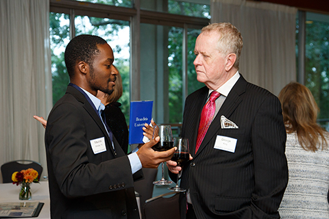 Maurice Windley '19 and guest George King speaking at the reception