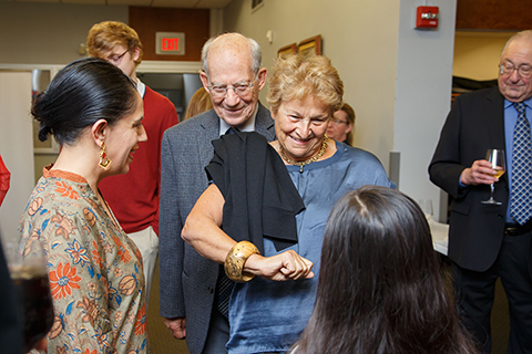 A group of guests engaging in conversation at the reception