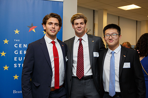 CGES student assistants Oliver Koch '20, Alexander Holtmann '21 and Paul Jiang '21 pose for a picture in front of the CGES banner