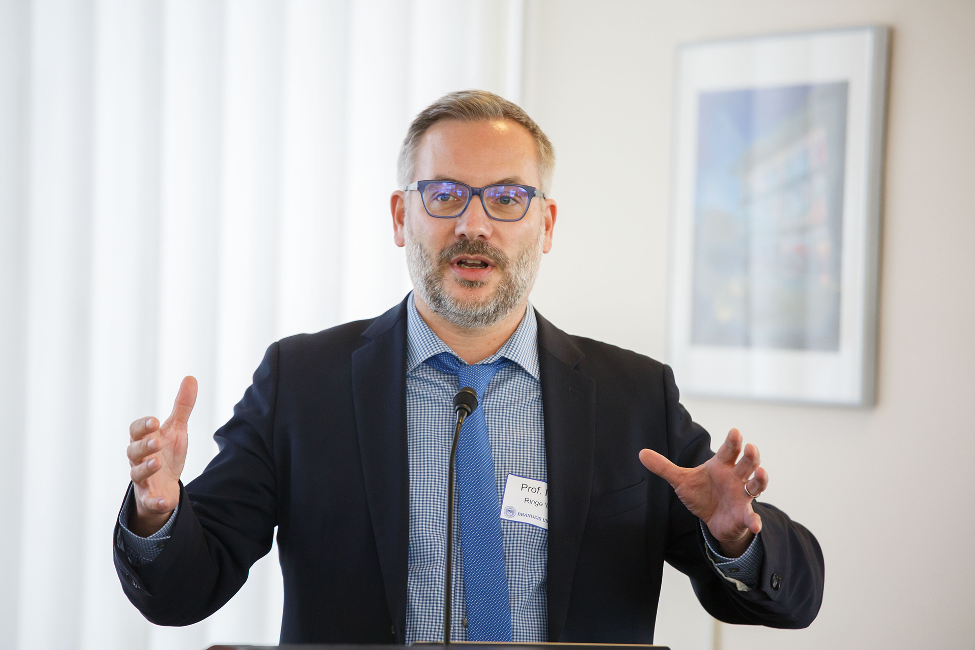 Panelist Nils Ringe '01 speaking during a panel discussion