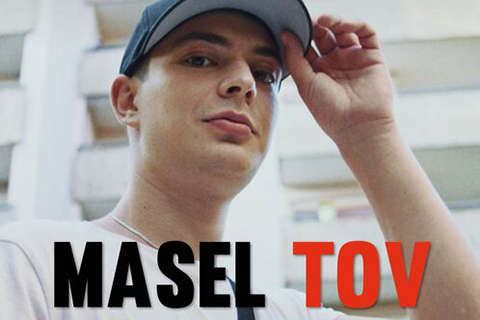 Man tipping his baseball cap and the text Masel Tov below