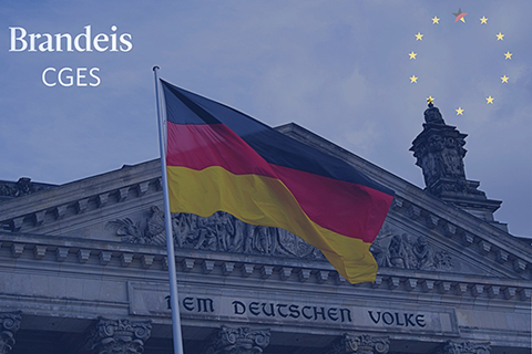 Picture of German parliament building with German flag in front