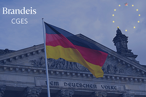 German parliament building with German flag in front