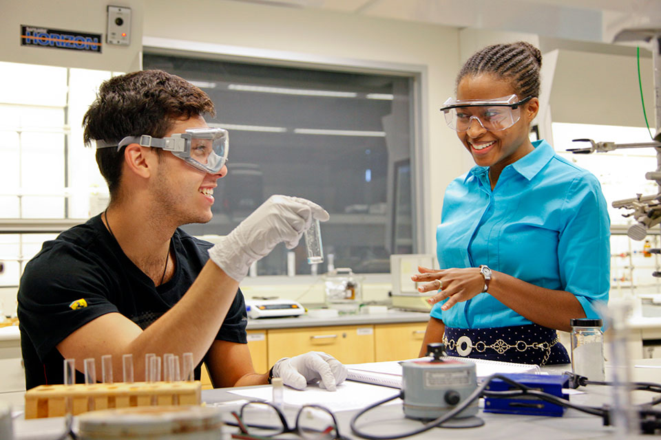 Chemistry student and faculty member working together in a lab