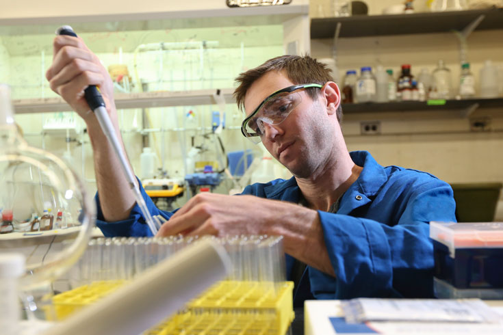 A graduate student works in the chemistry lab