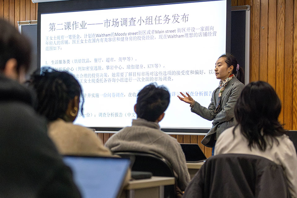 A professor teaches a classroom full of students.