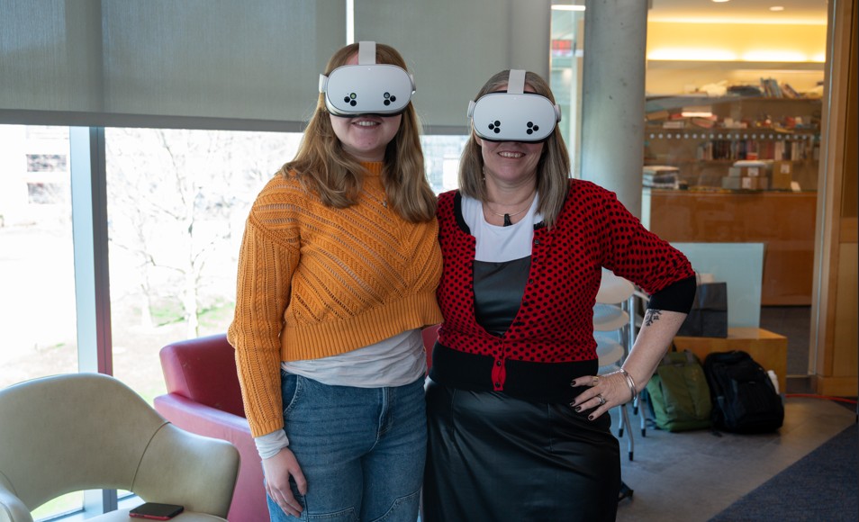 Professor Darlene Brooks Hedstrom and a student using VR Headsets to view ancient artifacts
