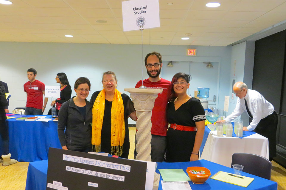 Elizabeth Allen, Professor Ann Olga Koloski-Ostrow, Benjamin Federlin, and Briana Schiff standing behind a table