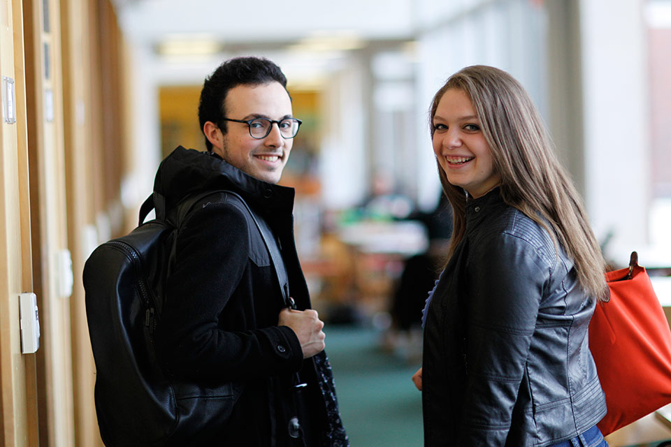 Brandeis students in the library