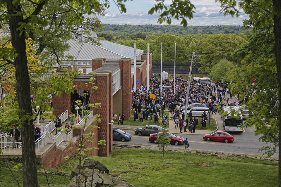 A bustling conclusion to an exciting day. Crowds of people fill the walkways on campus as they leave commencement.