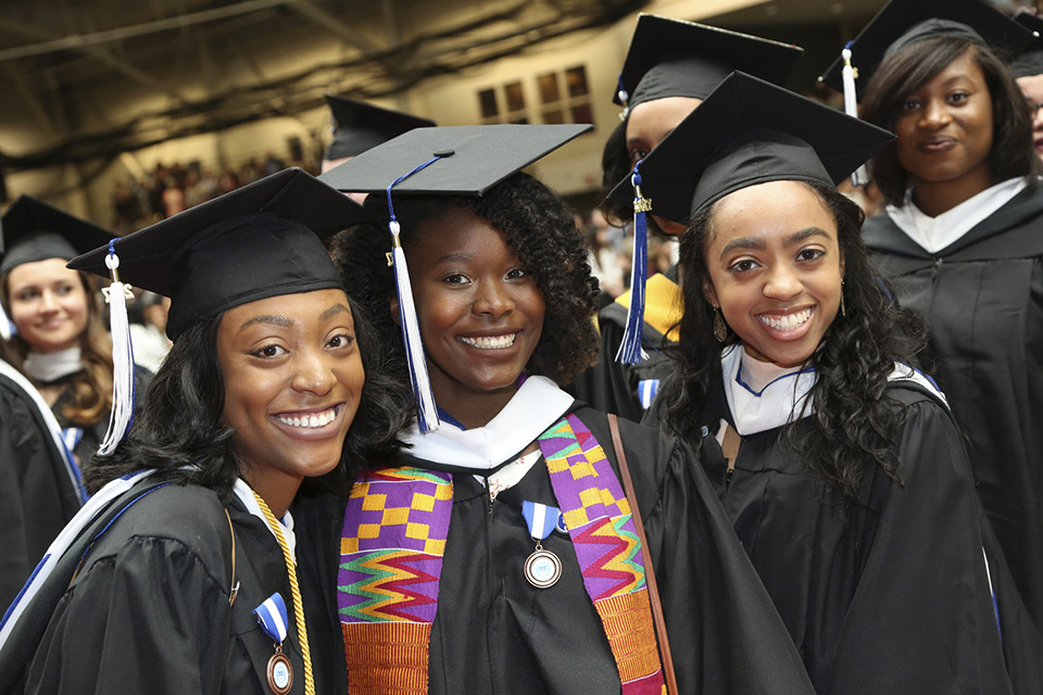 Young scholars eagerly await a jam-packed Commencement ceremony.