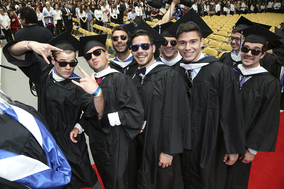 Looking cool and fly before graduating on a lovely Commencement morning. Eight graduates with shades.