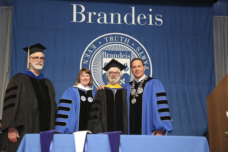 Leslie Lamport MA'63, PhD'72, a renowned computer scientist, is awarded an honorary degree in science. From left to right: computer science professor Jordan Pollack; Provost Lisa Lynch; Lamport; President Ron Liebowitz.