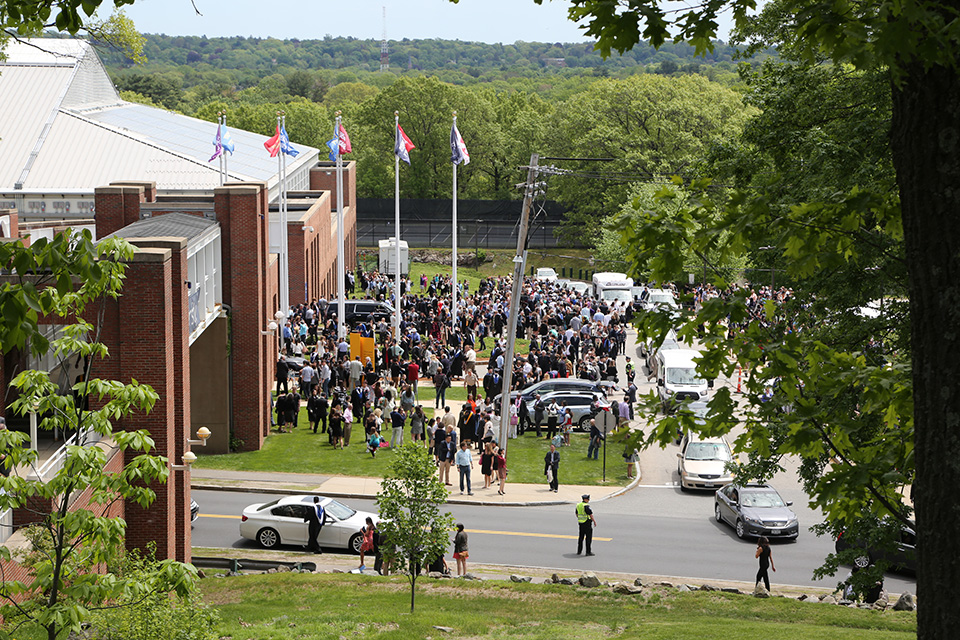 The Class of 2017 heads into the future. The graduates and guests leave the building and congregate outside.