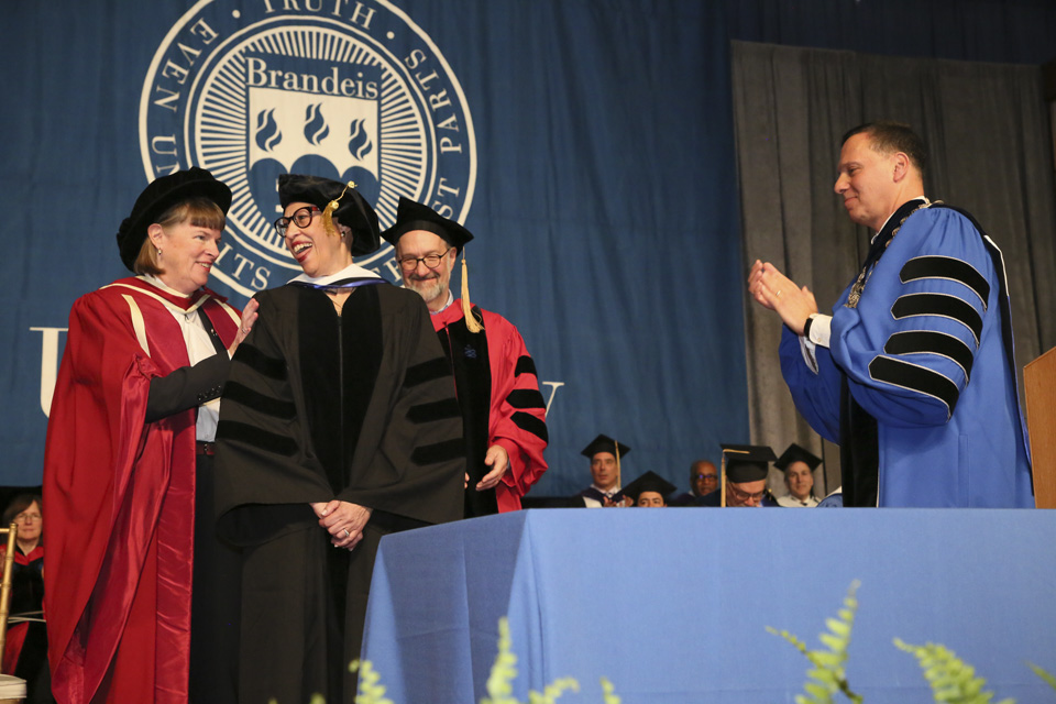 Susan R. Windham- Bannister laughs with Lisa Lynch, while David Weil and President Ron Liebowitz look on