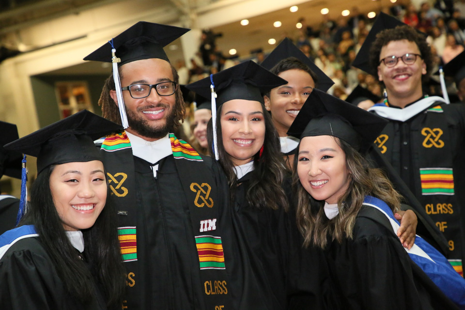 A group of students in caps and gowns