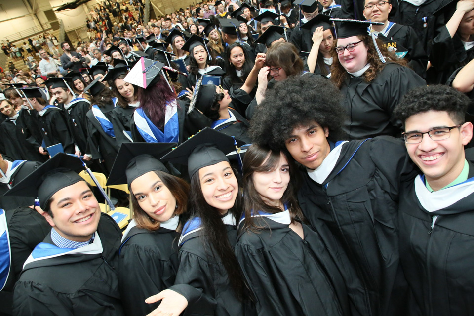 A group of students in caps and gowns