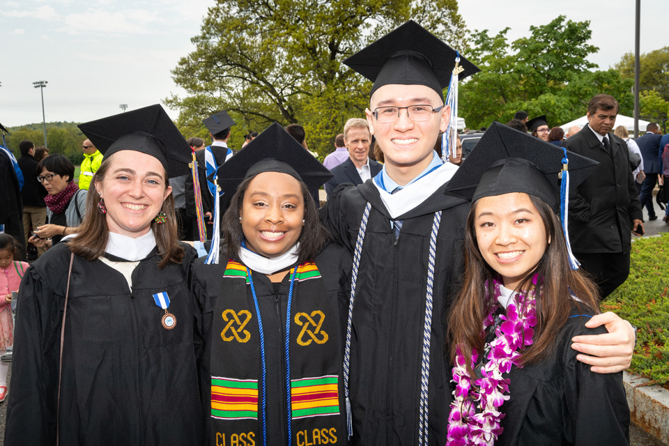 Graduates pose outside