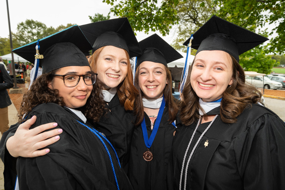 A group of graduates pose for the camera