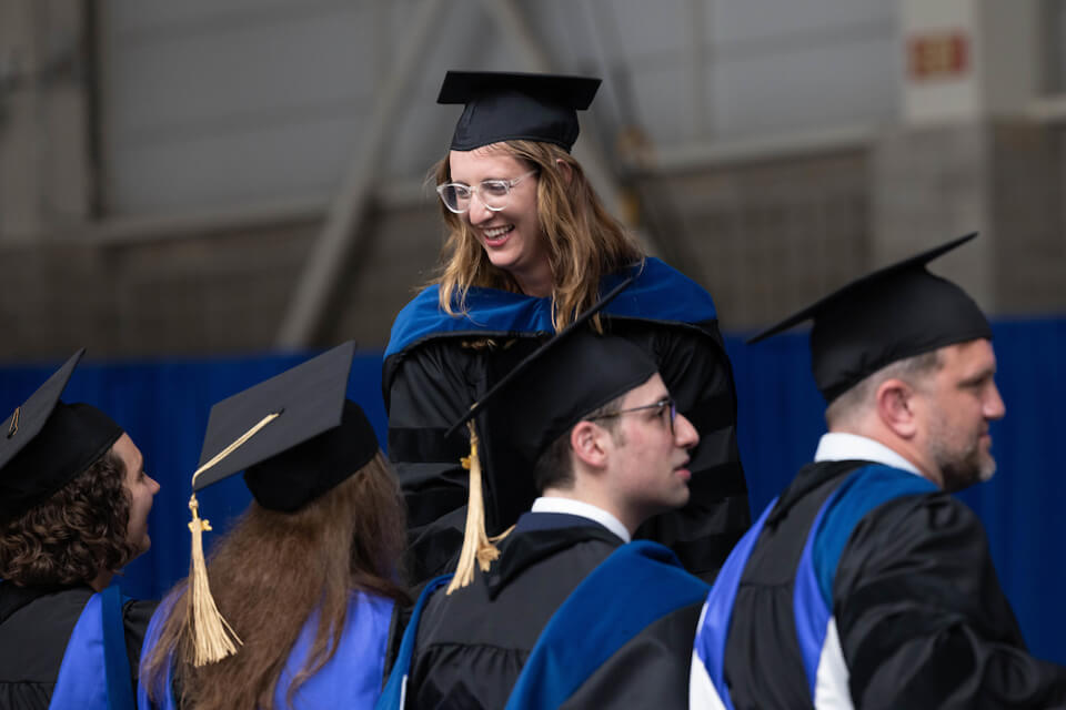 Eva Gurevich congratulates fellow graduates.