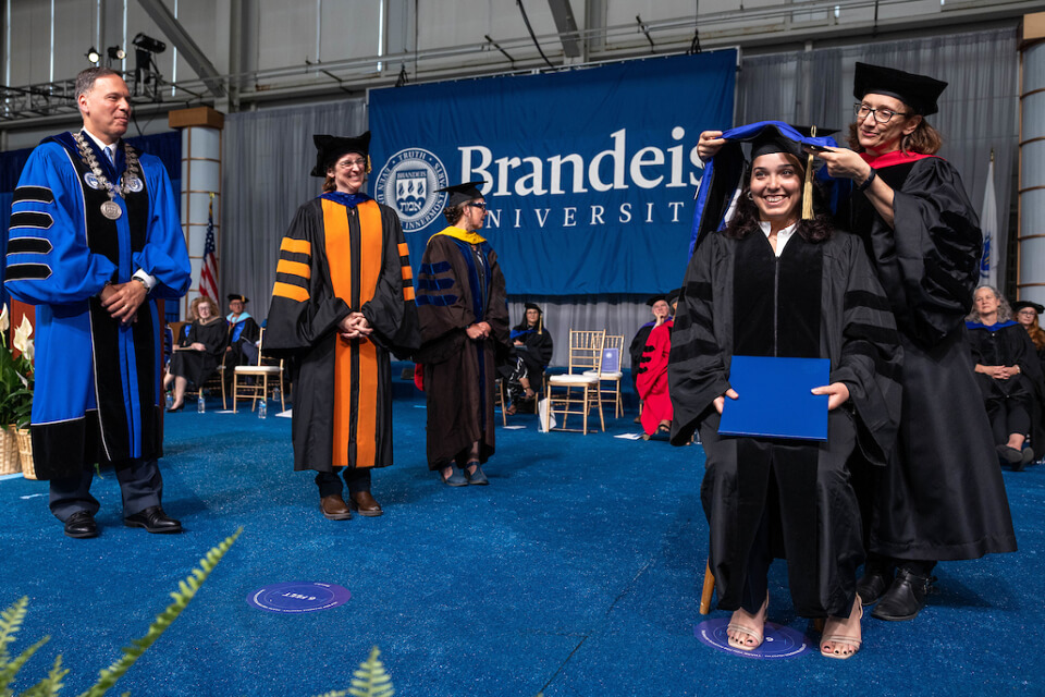 Francesca Capocasa, GSAS PhD ’23, is hooded for her PhD in physics during the event.