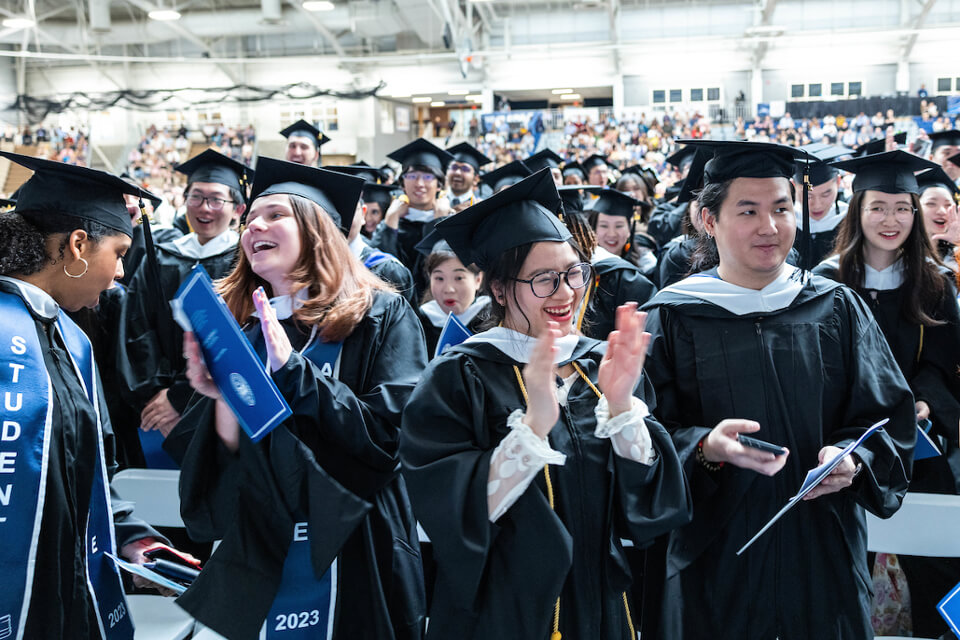 Graduates from the International Business School revel in the celebration together.