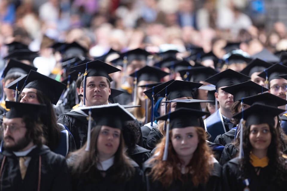 Graduates fill the Gosman Center.