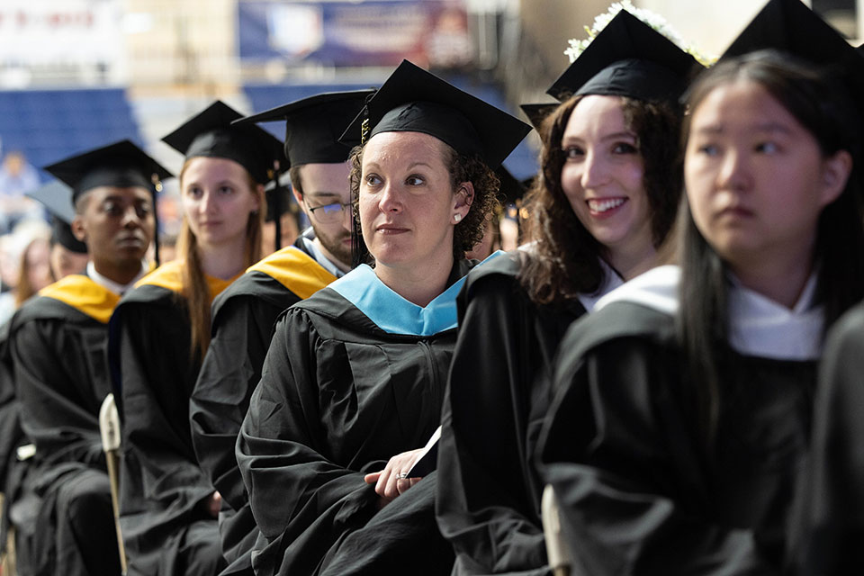 Graduates listen during the Graduate Commencement Ceremony