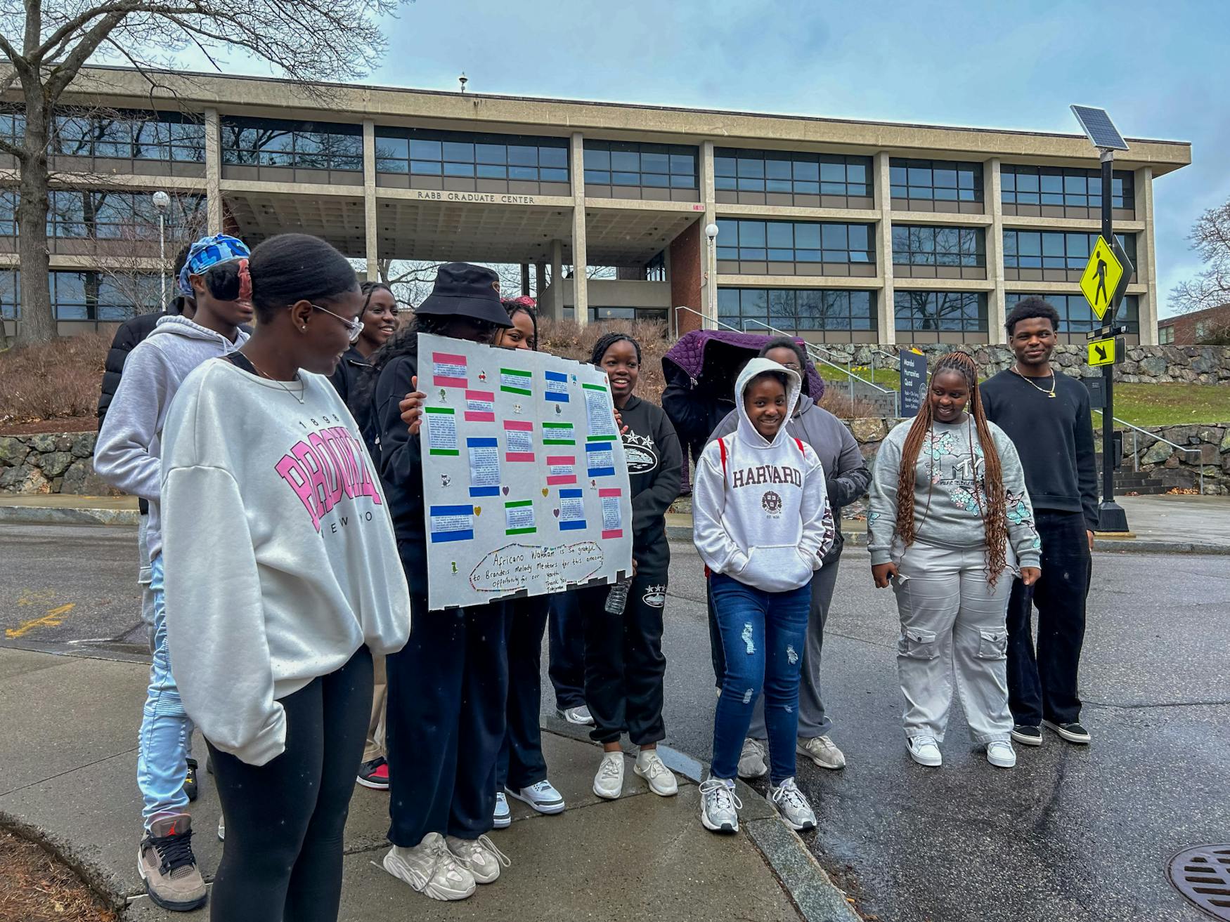 African Waltham students present a big homemade "thank you" card to Melody Mentors