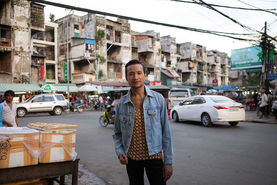 Prumsodun Ok in front of the famed (and now demolished) "White Building" in Phnom Penh, Cambodia 