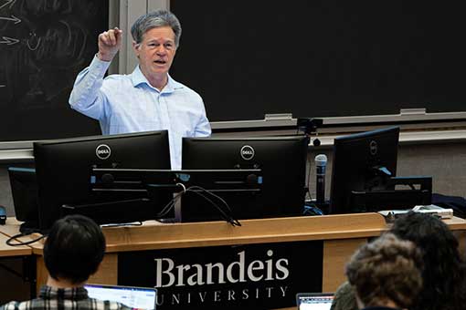 Professor Tim Hickey speaking in front of a classroom