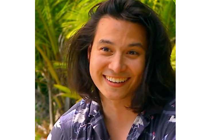 Andy Rueda outside, smiling at the camera
