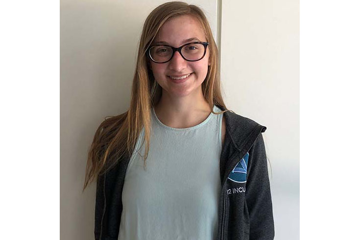 Brynna Kilcline portrait; she's smiling at the camera