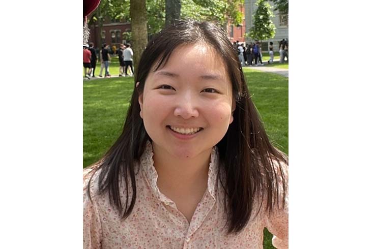 Portrait of Kimmy's smiling face outside