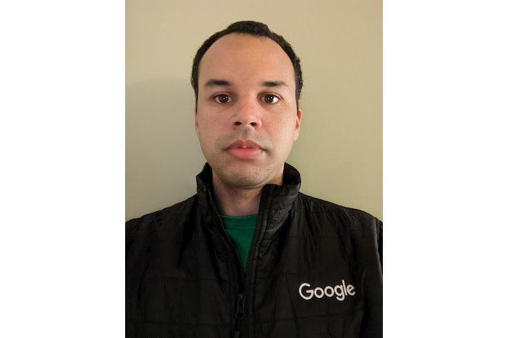 José wearing a black Google fleece looking into the camera