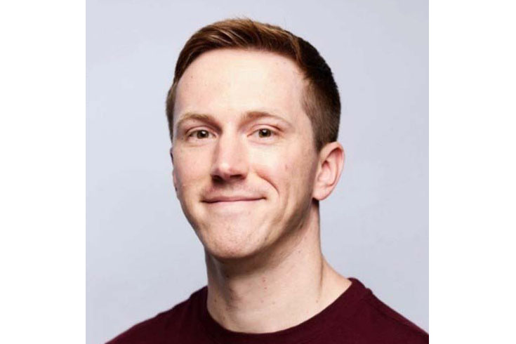 Chester's headshot against a light blue background