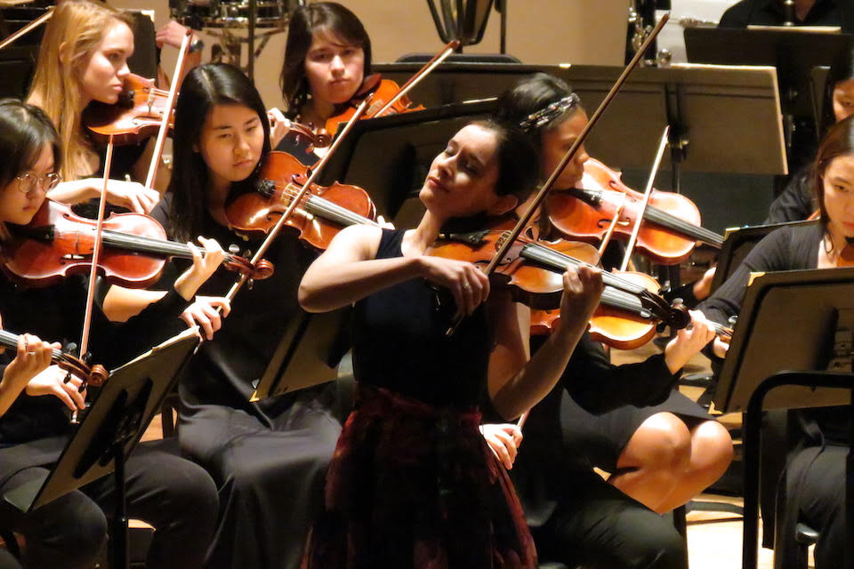 Andrea Segar plays the violin with the Brandeis-Wellesley Orchestra