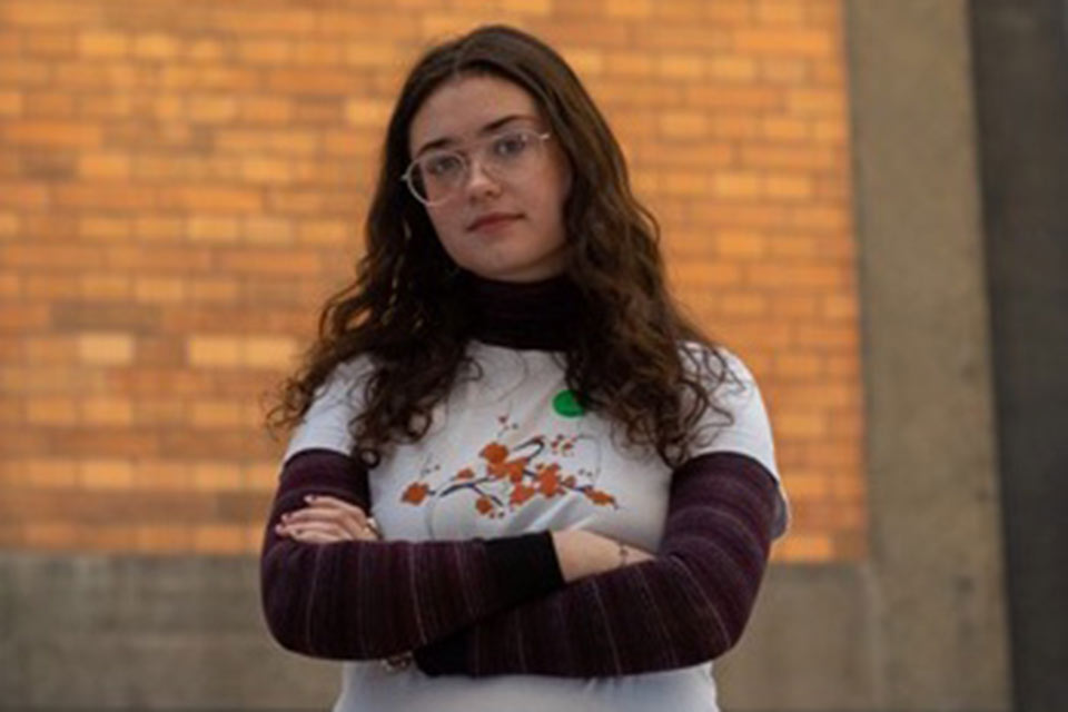 girl standing with arms crossed