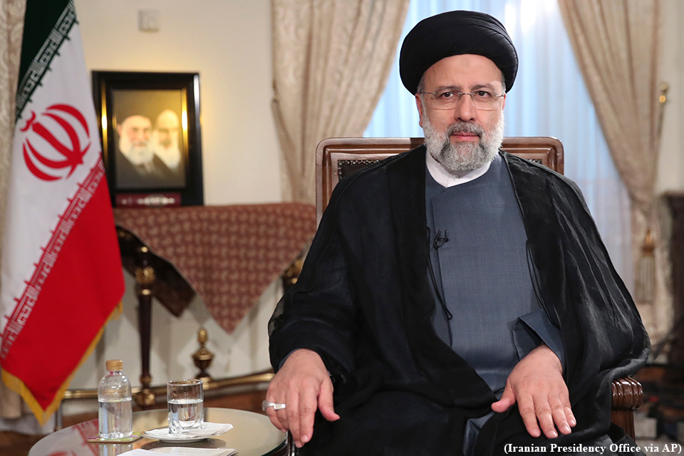 Iranian President Ebrahim Raisi sits in chair