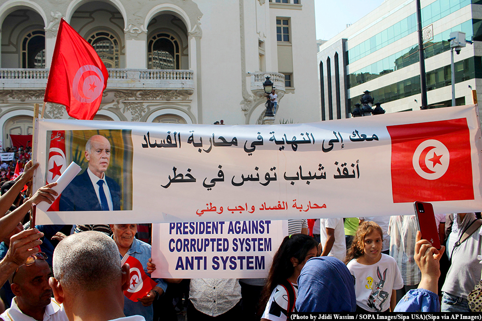 Supporters of Tunisian President Kais Saied hold a rally in central Tunis on October 3, 2021.