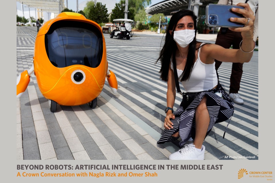 girl taking a selfie in front of a robot