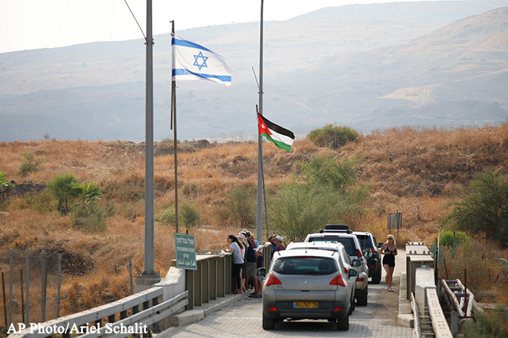 Saudi man waving Saudi and Turkish flags