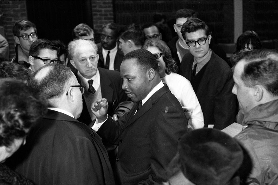 Dr Martin Luther King Jr talking to administrators and students on campus