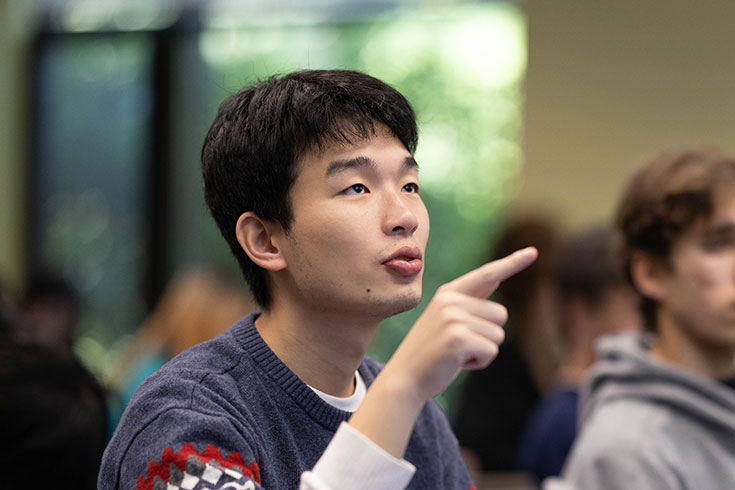 A student attends an economics class.
